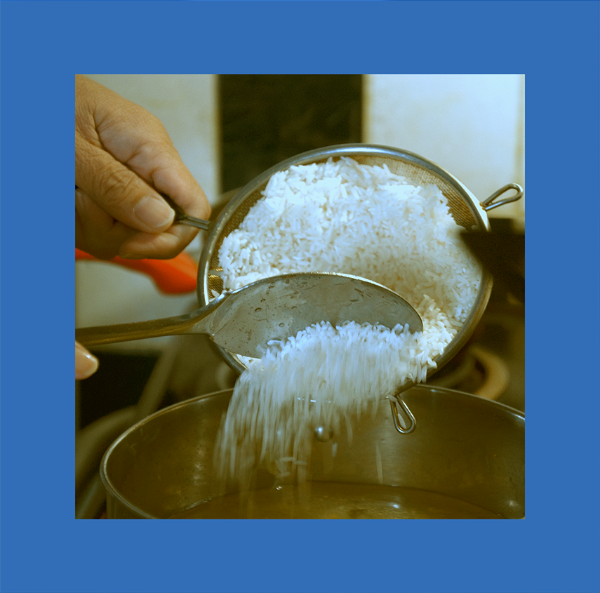 dad putting rice in pot